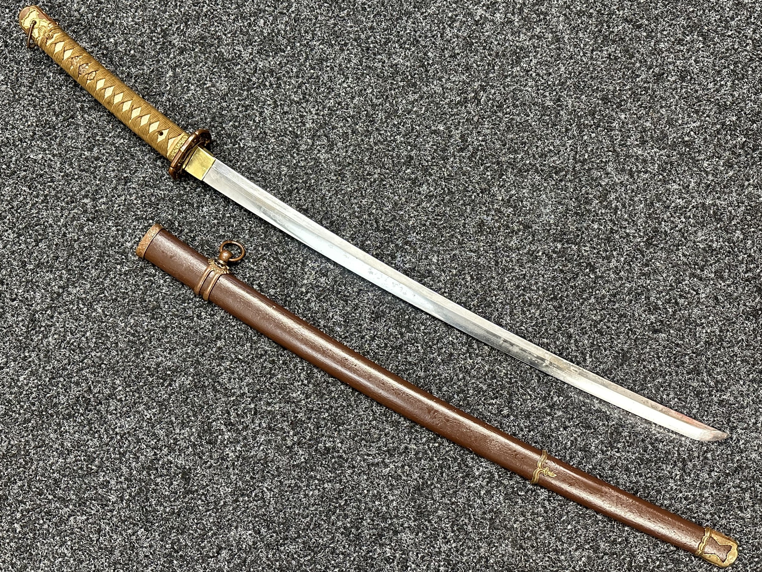 WW2 Imperial Japanese Army Officers Shin Gunto Sword with single edged blade 692mm in length. Signed tang. Overall length 957mm. Complete with scabbard.