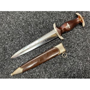 WW2 Third Reich SA Deinstdolch 1933 Pattern Dagger with double edged blade 221mm in length, etched motto "Alles Fur Deutschland" along with makers mark "RZM M7/13" (Artur Schüttelhöfer Solingen). Wooden grip inset the SA emblem and Eagle. Overall length 349mm. Complete with scabbard with original painted finish.