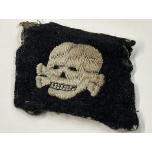 WW2 Third Reich SS Totenkopfverbande rare early pattern collar tab with left facing skull. This item was obtain by a British Veteran of the 63rd Anti Tank Regiment Royal Artillery when his unit entered Bergen-Belsen Concentration Camp in April 1945. New to the market.