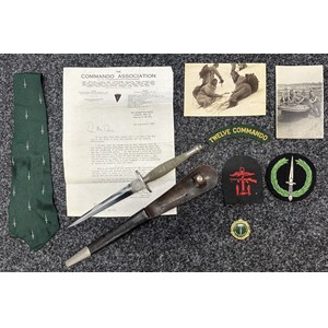 WW2 British 1st Pattern Fairbairn-Sykes Commando knife with provenance to Pte David Davis ex No 12 and No 4 Commando. New to the market. Double edged blade 171mm in length. Etched panels with "The F-S Knife" and "Wilkinson  Swords Co Ltd London". Blade is in very good condition. Overall length 300mm. Scabbard is the correct first pattern style with retaining strap with working press stud fastner. Both tabs to the scabbard have been very carefully period removed. Correct nickle plated chape. Also including is the lot are one of his original 12 Commando shoulder titles, a single Combined Operations formation sign, Commando Association tie, blazer badge and medallion togther with a letter of condolence from the association on his deather in 1985. Plus two photos, both with captions to the reverse. Background detail: Pte Davis was on the Lofoten Islands Raid. He was invalided out of the Commandos prior to D Day. When asked by his family if he had used the knife his reply was "We were Commandos...".