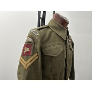 WW2 British Parachute Regiment Australian made Battledress Blouse named to  "Dix, S Coy, 6th" and is additionally named under the breast pocket flap in ink. The Blouse is a Size 4 and is maker marked "HR Hayman Pty Ltd" along with "Blouses, Khaki Cloth, Battle Dress British Pattern, Year 1946". All insignia is originally sewn with printed Parachute Regt shoulder titles and Pegasus formation signs. Corporals stripes are hand sewn in place. Medal ribbon bar is hand sewn. Included is a colour photo of Mr Dix wearing his BD in 1995 for the VE Day celebrations and a re-print photo of him with a PIAT in Italy in 1943. Also included is his Maroon waistcoat often wore at reunions etc. New to the market. (Background info: 1103198 Cpl Fred Dix served originally in the RA from 1940 and later volunteered for the Airborne Forces. Saw active service in Africa, Italy, Greece and Palestine. PIAT gunner in S Coy, 6th Battalion Parachute Regt, 2nd Independent Parachute Brigade.)