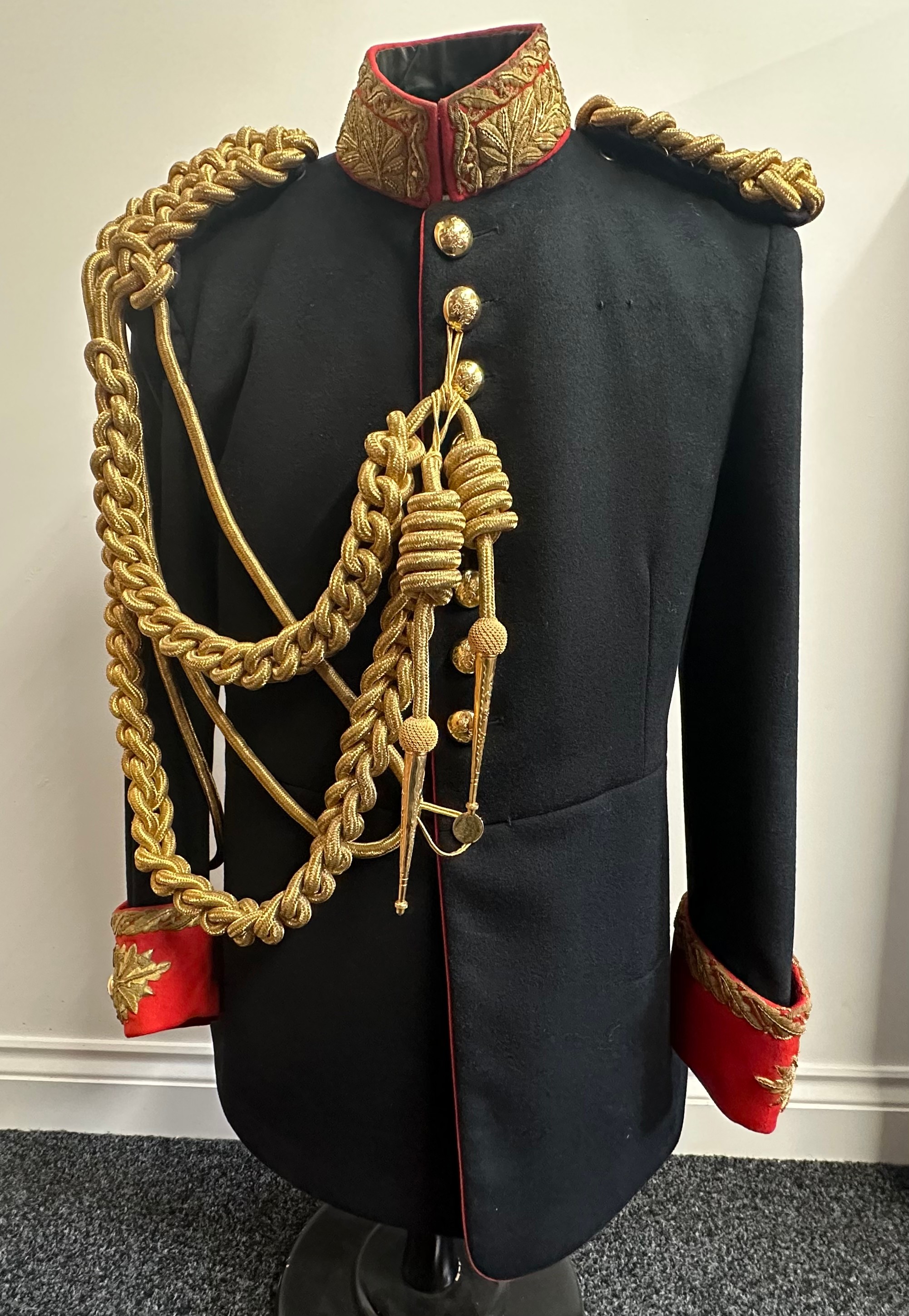 British Blues & Royals Captains Full Dress Uniform Tunic. Queens Crown buttons. Complete with aiguillettes. Heavy gold wire bullion embroidery to collar and cuffs. Loops to breast for medal bar.
