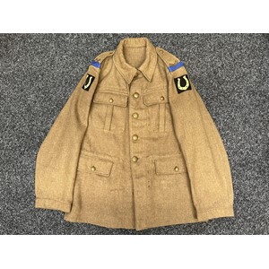 WW1 British Other Ranks Service Dress Jacket with Middlesex Regiment brass shoulder titles, Blue Company slip on's, 37th Infantry Division Yellow Horseshoe on Black Formation signs. General service buttons. Remains of original paper label to lining. Size 25, chest 40 to 41 inch. WD Inspection marked 155 M with Broad Arrow. Bone Good Luck Charm pinned to underside of collar in the form of a diamond with a Horse Shoe in the centre.