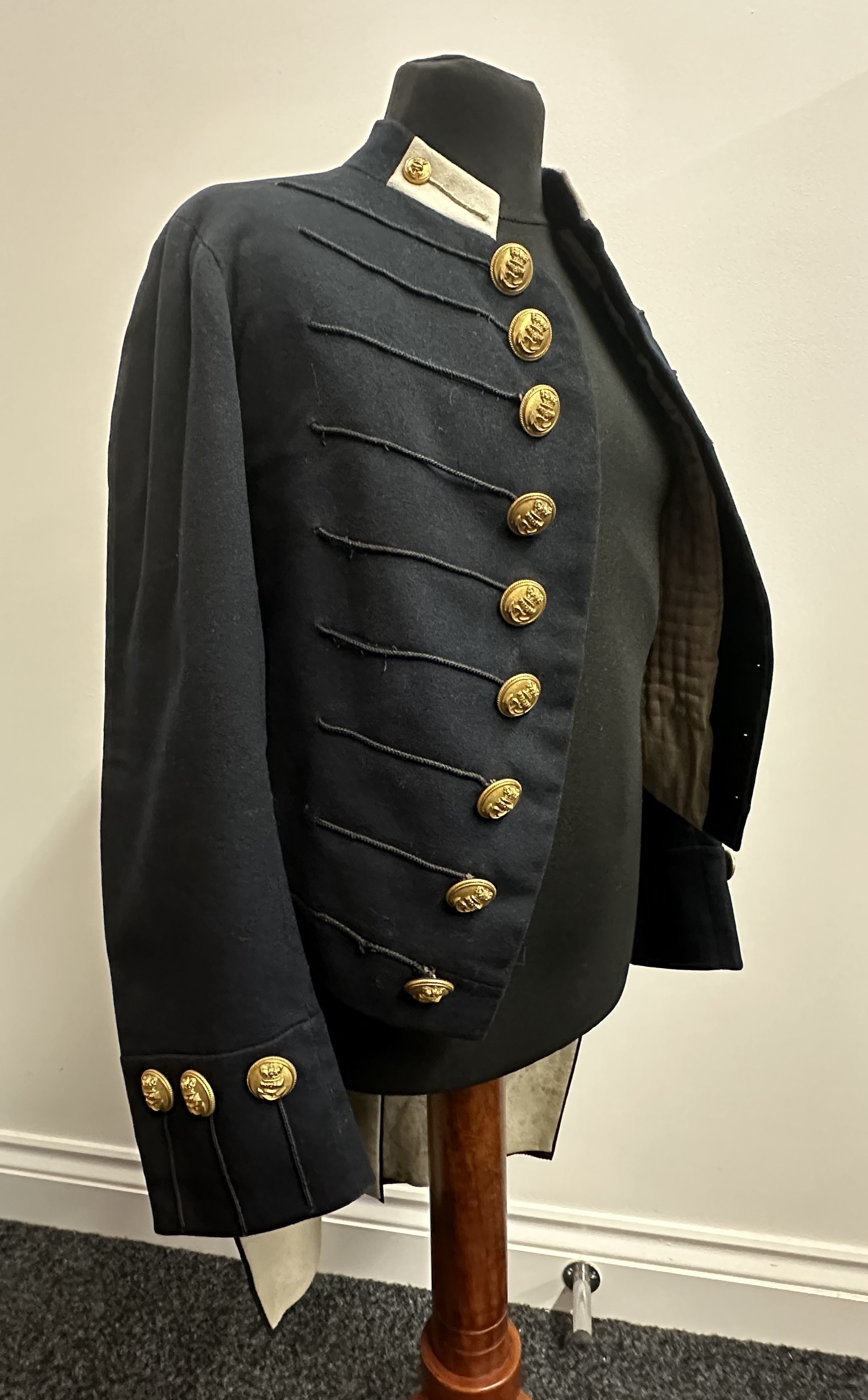Victorian Royal Navy Boy Midshipman's Jacket with VR Queens Crown Buttons. Maker label to neck ""SW Silver & Co. Cornhill, London". No name or size markings. Chest approx. 26 inch. Complete with torso form display bust.