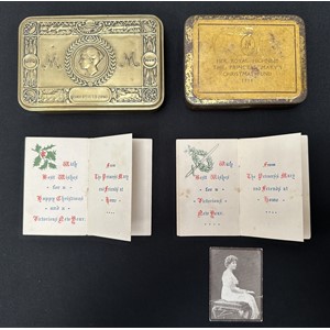 WW1 British Princess Mary's Gift Tin 1914 along with Greetings Cards for 1914 and 1915 and another tin with rare printed label stating "Her Royal Highness The Princess Mary's Christmas Fund 1914". Size of tin 105mm x 78mm.