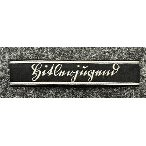 WW2 Third Reich Sutterlein "Hitlerjugend" cuff title. Uniform removed, full length and complete with RZM paper label. Worn by staff members of the Reichsfuhrung der Hitlerjugend.