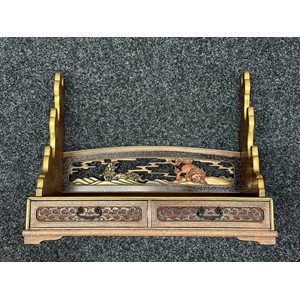 Japanese Sword Display Stand for three swords. Wooden construction with decorative brass inlays. Two drawers. Width 49cm, height 38cm, depth 22cm.