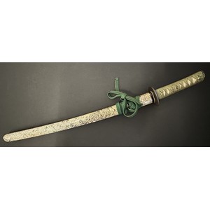 Japanese Wakizashi Sword with single edged blade 570mm in length. Hamon line to edge of blade. Tang is signed. Green cord binding to Rayskin grip. Menuki in the form of Deer. Overall length 733mm. Complete with Rayskin covered Saya which has some old labels. Fitted with a Kozuka knife with single edged blade 115mm in length. Unsigned. Overall length 212mm. Fitted with a green Sageo cord.