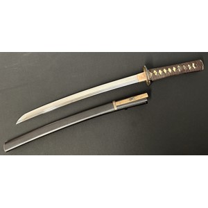 Japanese Wakizashi Sword with single edged double fullered blade 440mm in length. Hamon line to edge of blade. Two holes to tang. Overall length 610mm. Saya is complete with knife with single edged decorated blade 113mm in length with signed handle. Complete with Certificate