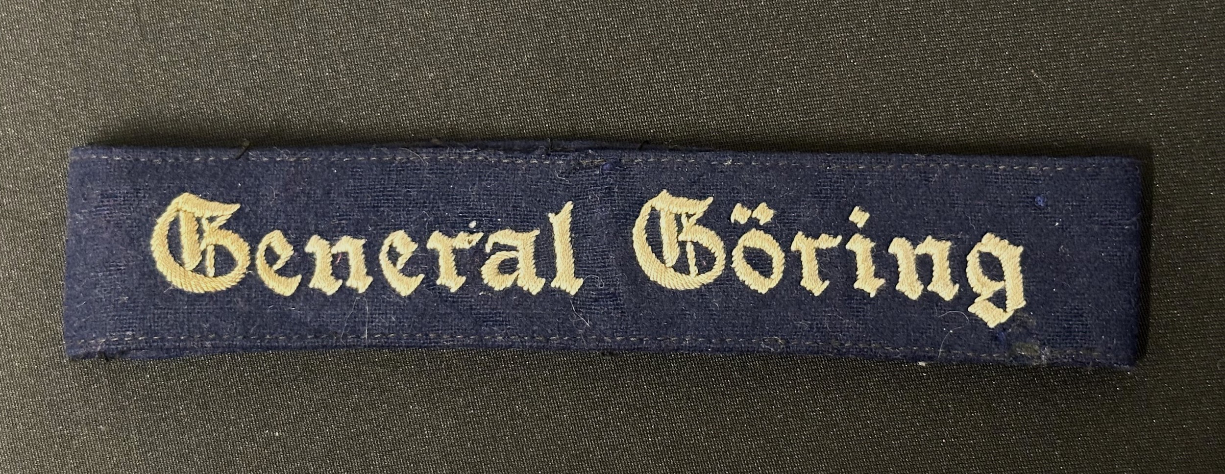 WW2 Third Reich Luftwaffe Enlisted Man's "General Goring" Ärmelband Cuff Title. Full length, uniform removed and still stitched together.