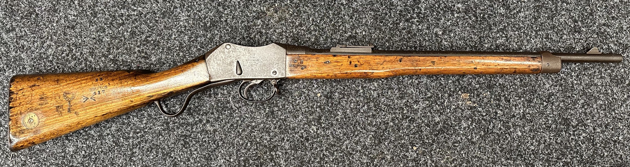 .303 Cal MkI Black Powder Cartridge Martini Metford Cavalry Carbine MkIII Serial No. 269. Marked VR Enfield 1897. 515mm long barrel. Overall length 947mm. Working action. Very well marked overall with WD Sold out of service markings, stock marked "BB W.H.PTON". Brass ring to butt with unit marking " "5 1902 RD 3 LF 18". Studs missing from stock for the leather sight protector. No cleaning rod. NOTE: Section 58 (2) No Licence required in the UK.