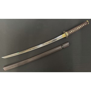 Japanese Kan'ei era Wakizashi Sword circa 1624-1644. The sword is complete with a NTHK Shinsa 2003 Certification done at the Euro-Group Token Kai and was classed as "Kanteisho - 75 points - Important". Single edged blade 620mm in length with very good Suguha (Straight) hamon line. Two holes to tang. Unsigned. Iron Tsuba, unsigned. Samegawa Shagreen Ray Skin grip with brown Tsuka-ito cloth binding with Menuki to both sides. Overall length 845mm. Brown lacquer finish to the Saya scabbard.