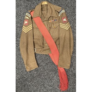 WW2 British Parachute Regiment Midlands Battalion 1940 pattern Battledress Blouse complete with all originally sewn insignia. Printed Pegasus formation signs. Parachute wings. Colour Sgt's rank insignia. Named to "Kirkland WR 14941343". Size 10. Maker marked and dated "JD Feldman & Co, Belfast 1945". WD inspection code marked Z for 1945.