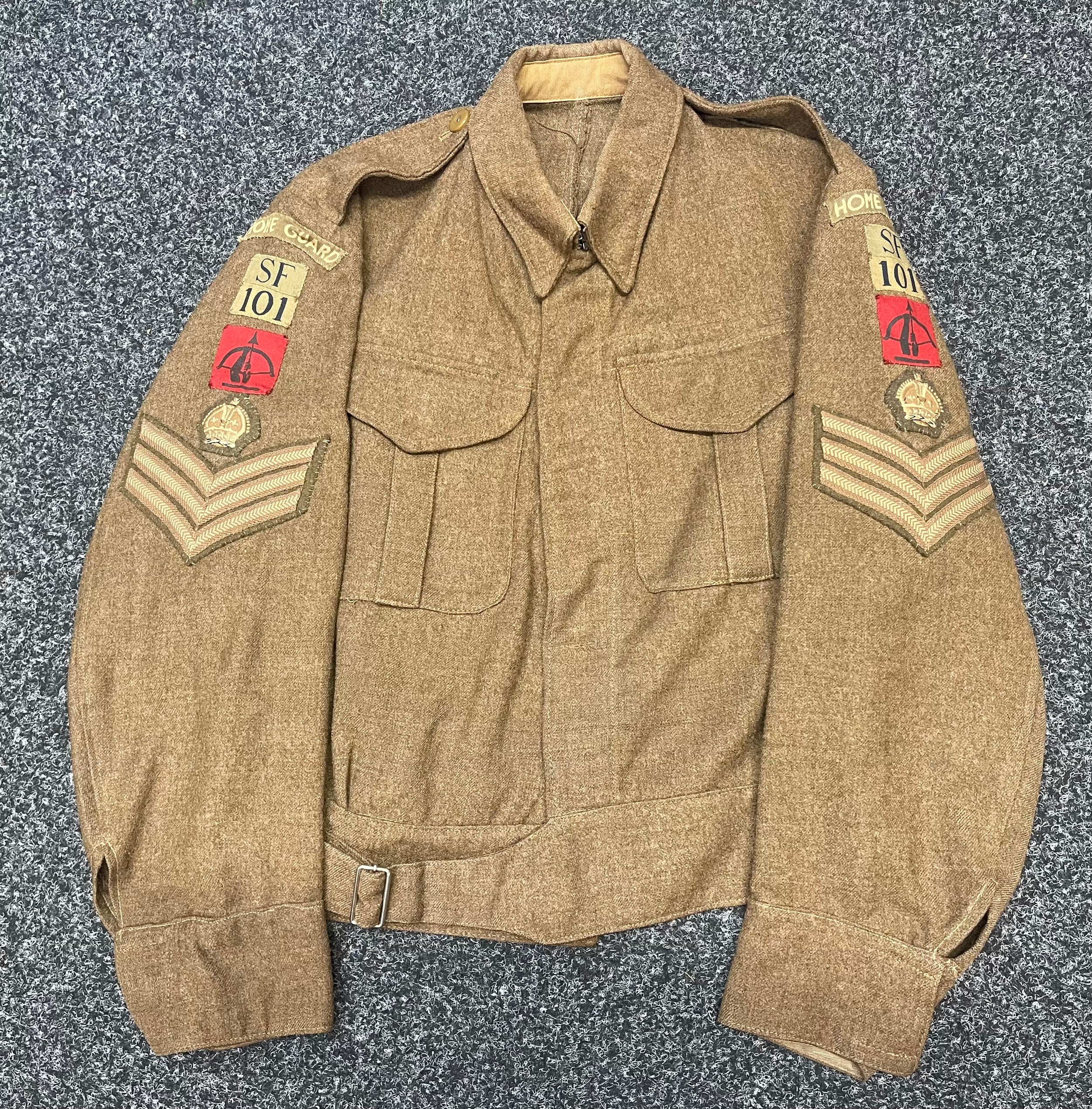 WW2 British Home Guard Battledress Blouse complete with all originally sewn insignia for a Staff Sgt in the Derbyshire Home Guard Z Battery Anti - Aircraft Battalion. Size 16 and dated 1940.