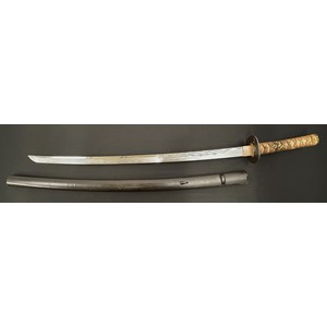 Japanese Katana Sword with single edged blade 715mm in length with good Hamon line to the cutting edge. Blade is decorated to both sides, one side with a deep engraving of a Dragon. Tang is signed. Copper habaki & Oval Shibuichi Tsuba with Bird and Floral decoration, unsigned. Samegawa Shagreen Ray Skin grip with brown Tsuka-ito cloth binding with gilt Dragon Menuki. Overall length 900mm. Complete with brown laquered finish Saya scabbard.