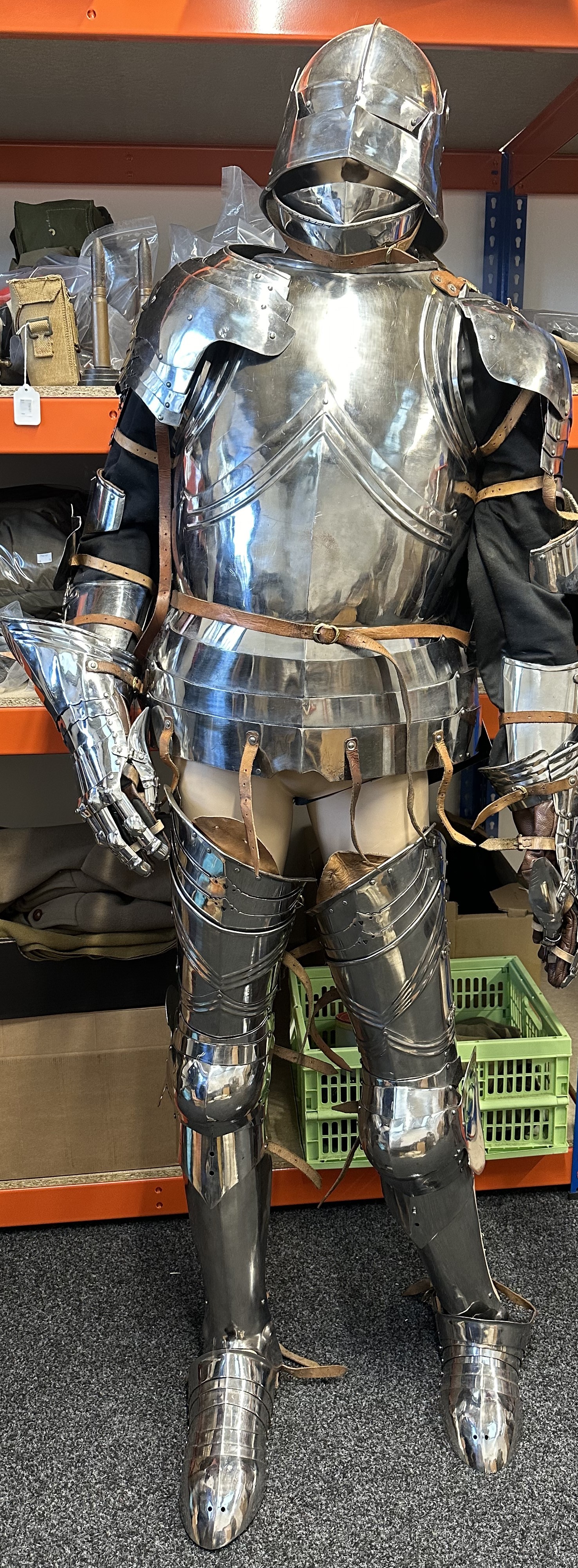 Replica War of the Roses Armour comprising of Sallet Helmet, Bevor and Gorget, Cuirrass Breastplate & Backplate, Spalders, Brassards, Gauntlets, Cuisses, Poleyns, Greaves and Sabatons for the feet. Complete with black under jacket, black and white woolen leggings and a black cloak with White Boar insignia of King Richard III. Comes complete with the  mannequin.