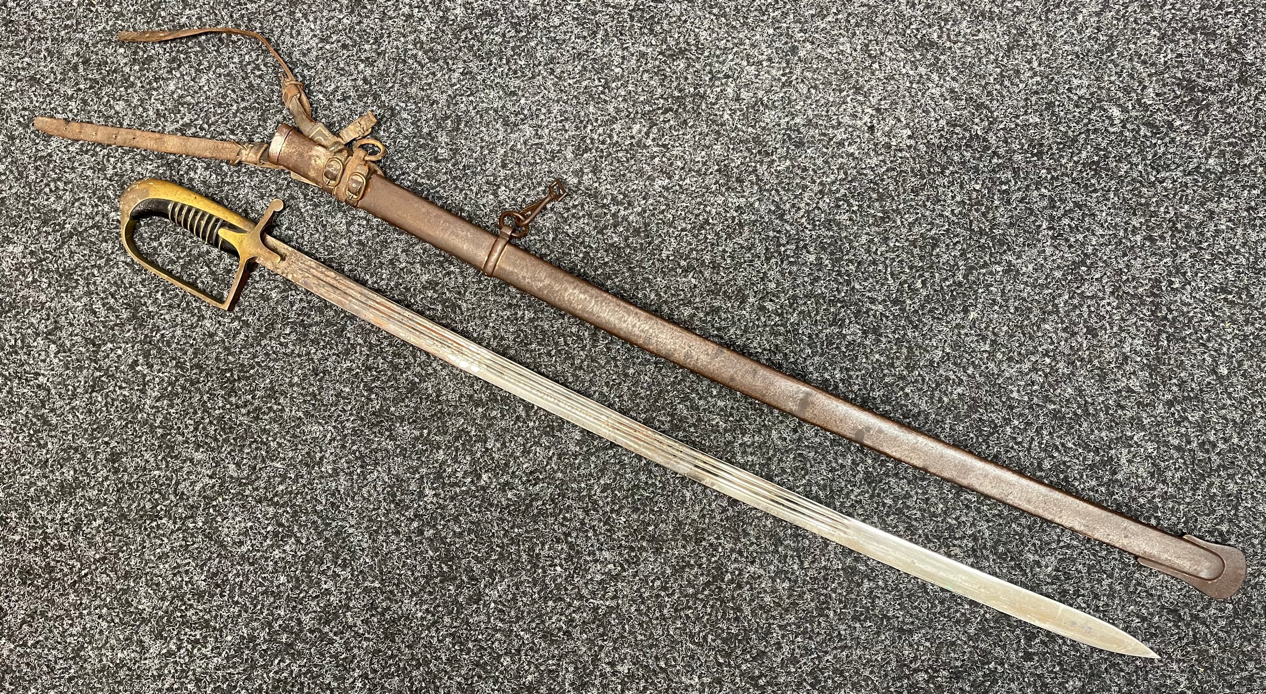 Pre-WW2 Polish Officer’s Sword wz.21 with triple fullered single edged blade 795mm in length with etched decoration of Polish Eagle and motto "Honour & Fatherland" to one side of the blade. Maker marked "G Borowski, Warsaw". Wire bound wooden grip. Brass guard. Overall length 925mm. Complete with steel scabbard which retains it's original leather frog.