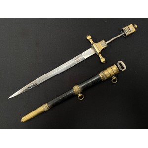 WW2 Polish Naval Officers Dagger with double edged blade 235mm in length with etched panel featuring a Polish Eagle and the motto "Honor  i Ojczyzna" (Honour & Fatherland). Maker marked "G Borowski". Overall length 345mm. Complete with leather bound scabbard. The scabbard throat which holds with blade keepers is loose and required repair.