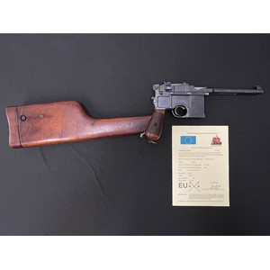 Deactivated Mauser C96 Semi auto pistol 7.63mm cal serial number 9819 complete with original wooden holster/shoulder stock. Barrel length 140mm. Overall length 300mm. Overall length with shoulder stock fitted 630mm. Stock is removable. All matching serial numbers to both gun and shoulder stock. Gun can be cocked and slide will hold on hammer. Working safety catch. Trigger moves but disconnected. Magazine floor plate is removeable. Currect EU/UK Deactivation Certificate issued June 2023. No licence required in the UK.