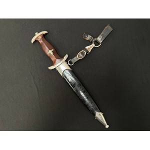 WW2 Third Reich NSKK Dienstdolch M1933 pattern dagger with double edged blade 220mm in length with "Alles fur Deutchland" etched motto and maker marked "RZM M7/103". (Josef Hack, Hackwerke GmbH, Steyr, Osterreich.) Overall length 350mm. Complete with black painted NSKK scabbard which is also complete with the scarce three part leather hanger which is maker marked "RZM M5/ 71 plus makers logo "olc" for  Overhoff & Cie, Lüdenscheid.