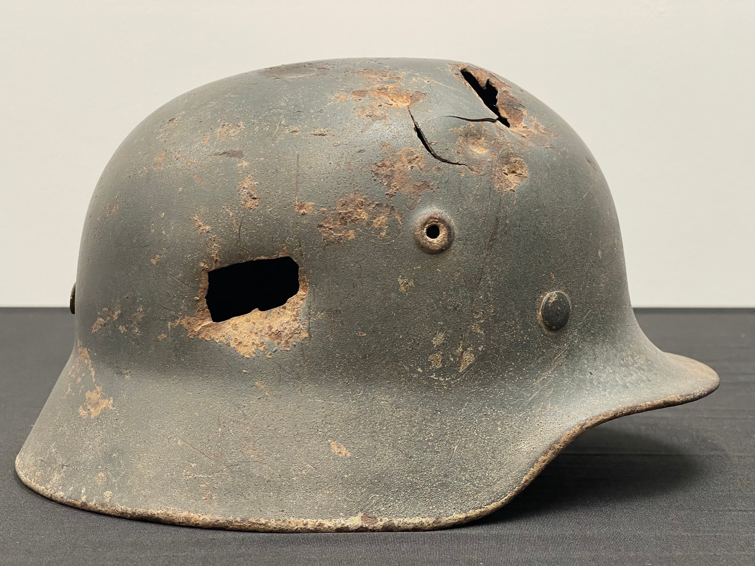WW2 Third Reich Waffen SS Relic Condition Bullet Holed Single Decal M40 Steel Helmet. Maker marked "Q". Complete with original liner band and pins in place.