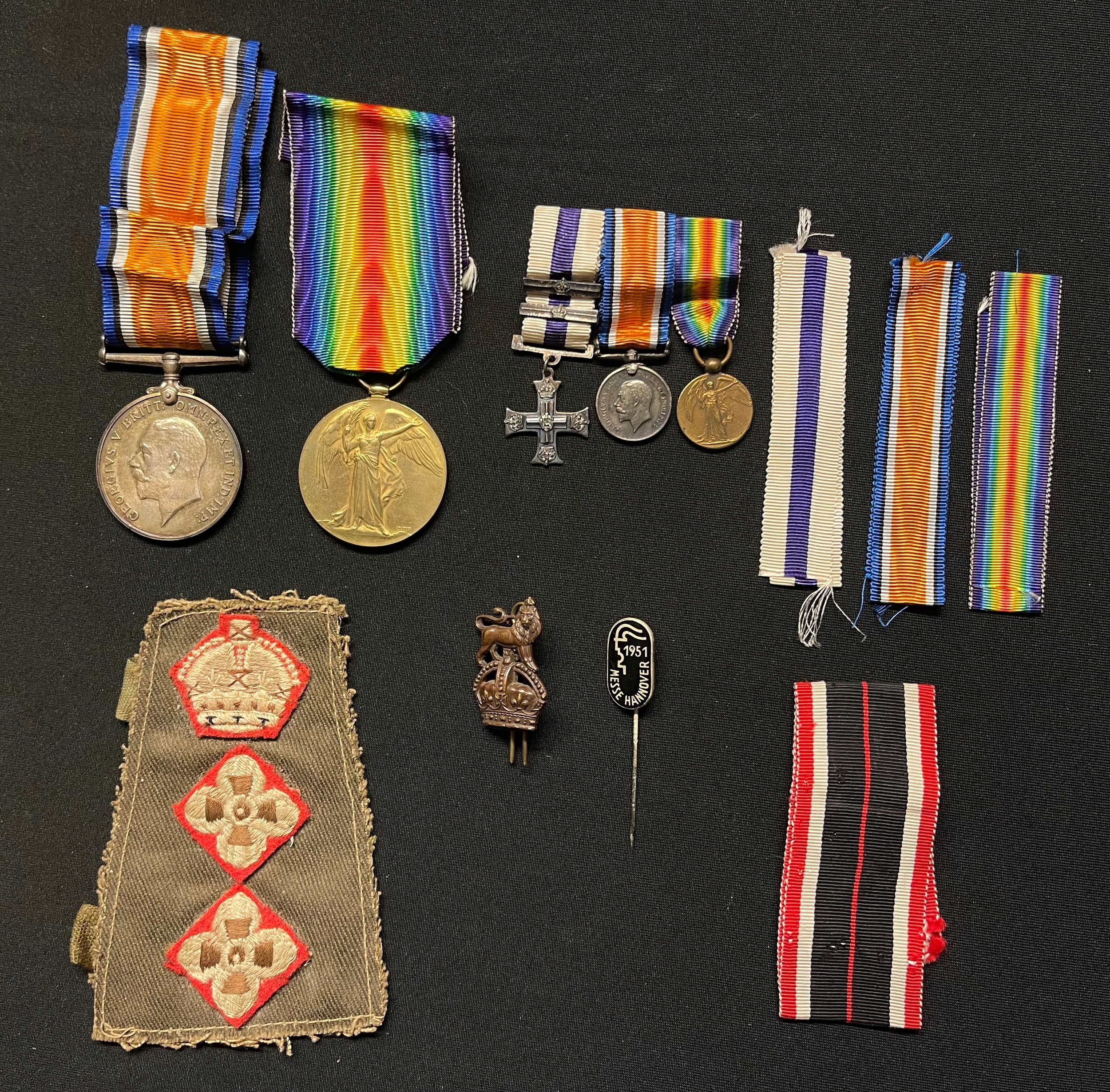 WWI British War Medal and Victory Medals to Captain Alfred Frithjof Merry MC and bars, 18th Battalion The Liverpool Regt. Complete with original ribbons. Along with his Miniature Medals comprising of the Military Cross with two bars, War & Victory Medals, all mounted on a pin backed bar. Spare mini ribbons. He also served in WW2 in the General Service Corps at a Lt. Col. Included are one GS collar dog and one slip on rank slide, plus a souvenir German War Merit Medal ribbon and Hanover Messe 1951 stick pin, Liverpool Rifles Officers Association rules booklet 1921, photocopy of his citation of each award of the Military Cross taken from the Gazette, Daily Telegraph War Map of Europe. In WW2 he served with MI 10 and gathered intelligence used at the Nuremburg Trails. Note:  Please see lot 4001 in this sale for his Brother's WW1 Death Plaque.