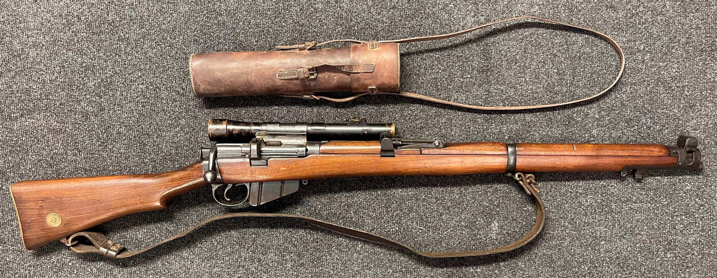 Deactivated WW1 British SMLE MKIII* Sniper Rifle serial number 71487. BSA maker marked and dated 1917. Brass Disc to butt marked "LINC 78". Fitted with Telescopic Sight by "Periscope Prism Company Ltd". Mounts marked "P8756" and "Patent 3027/1915". Complete with leather sling and front sight cover and leather case for the telescopic sight. Current UK/EU Spec. No licence required.