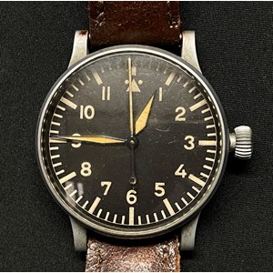 Reproduction Luftwaffe B Uhr Beobachtungs-uhren Navigators Wrist Watch Baumaster A. Complete with brown leather strap and with cardboard box. Luftwaffe stock number to side of case "FL 23883". Reverse of case engraved "RLM Nav B-Uhr" along with serial number 1032. Movement is marked "Alpina". Runs and ticks would recommend a clean and service.