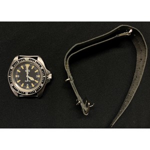 British Royal Navy Divers Quartz Wristwatch by CWC. Black dial with Arabic numerals, marked "Swiss Made". Case marked "0555/6645-99" along with "7573314" plus WD Broad Arrow and "268 94". Complete with original strap.