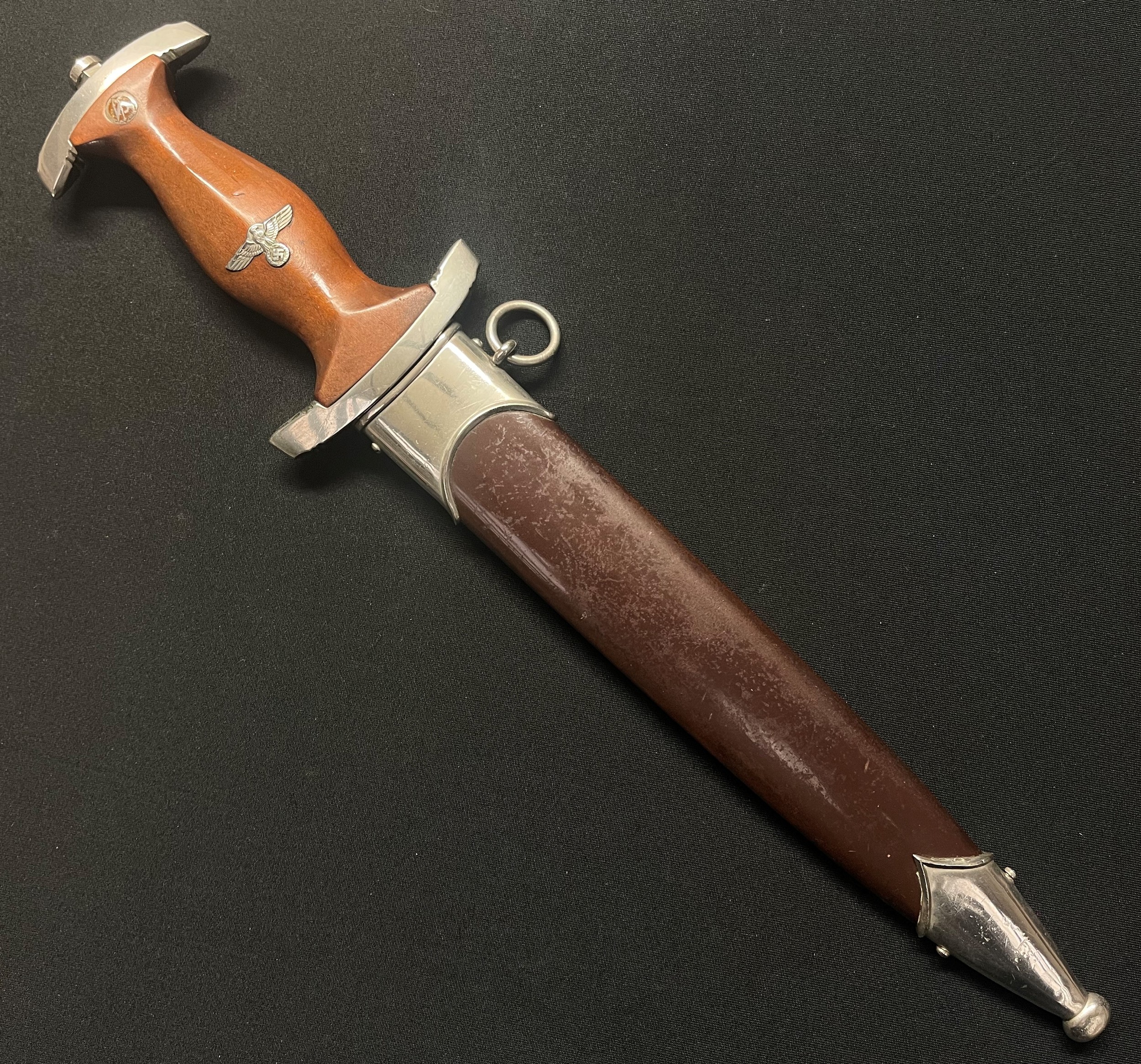 WW2 Third Reich 1933 Pattern SA dagger with 220mm long double edged blade with "Alles Fur Deutchland" motto, rare maker "CR Linder, Solingen - Weyer". Rated as a 7 out of 10 on the McSarr rairty scale. All early nickle fittings. Crossguard is SA Gruppe marked "NS" for Niedersachsen. Overall length 345mm. Complete with scabbard with early annodised finish and nickle fittings.