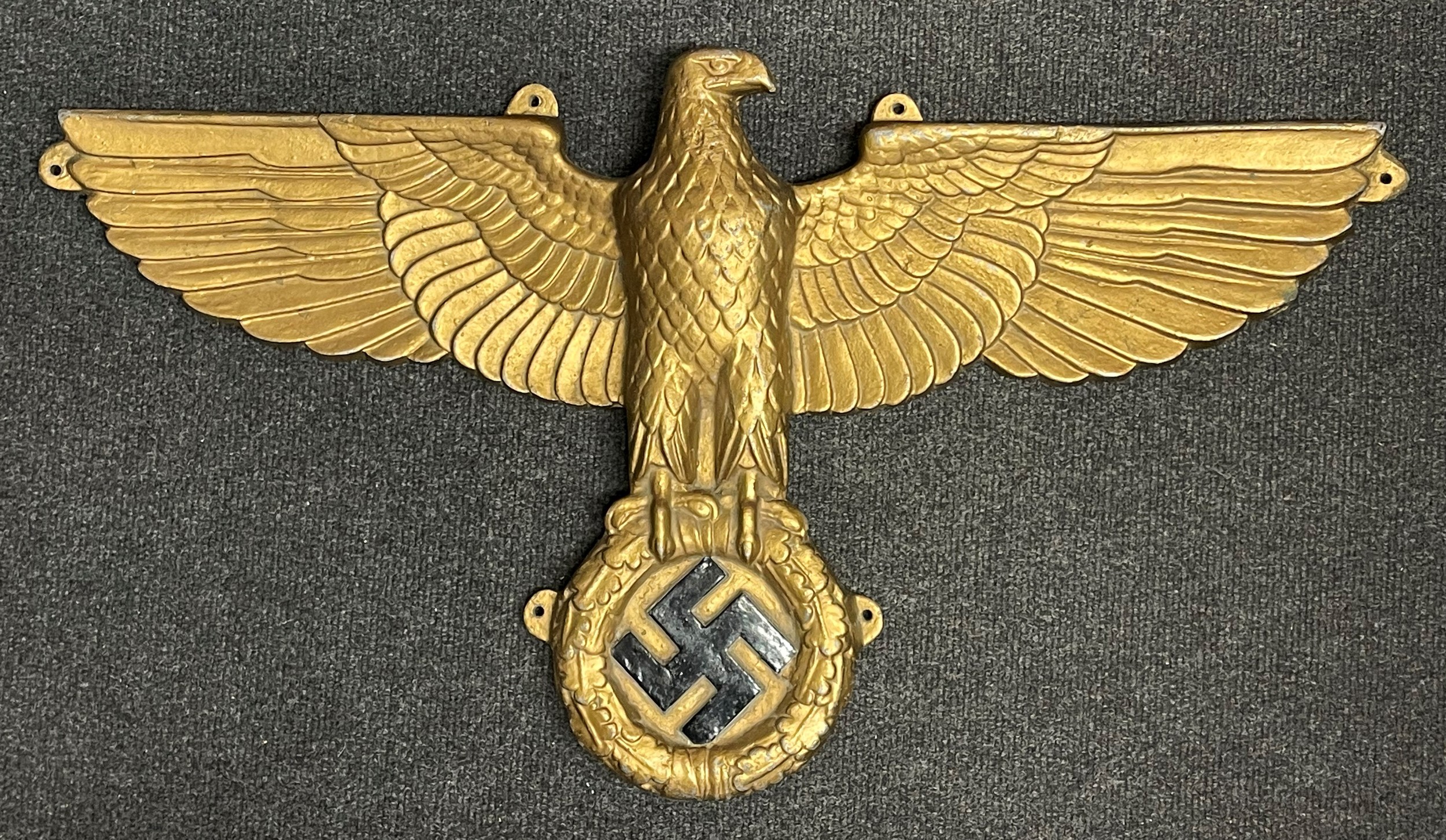 WW2 Third Reich Large Kreigsmarine U Boat or E Boat Reichsadler Cast Alloy Eagle, 715mm x 400mm. Depth 60mm to eagle's chest. No makers marks. Gilt painted finish with swastika in black with silver edges. Six integral cast tabs to edges for screw fixing.