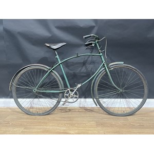 WW2 British BSA Paratroopers Folding Bicycle. Original unrestored condition. Frame number R49229. The bike retains it's original BSA leather seat, original BSA Handlebar grips, BSA Lamp bracket, correct pattern brakes to both front and rear, both correct brake levers along with both "War Grade" tyres. Post war it has been fitted with mudguards to front and rear along with new sproket and conventional pedals. Postwar green paint. Only 70,000 Parabikes were produced during the war.