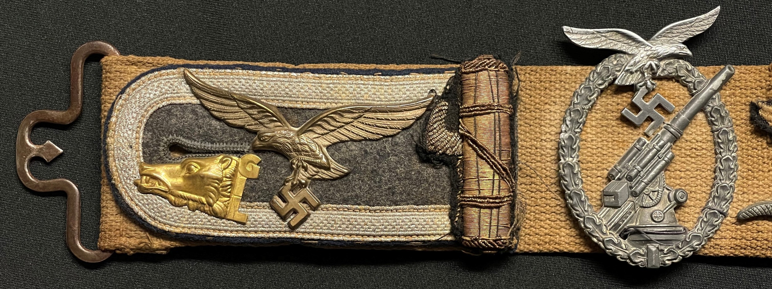 WW2 Third Reich Allied Soldiers Souvenir Hate Belt containing: various items of Luftwaffe and Heer and Italian Army insignia plus Luftwaffe Flak badge, Iron Cross 2nd class, Iron Cross 1st Class, War Merit Cross 2nd class.