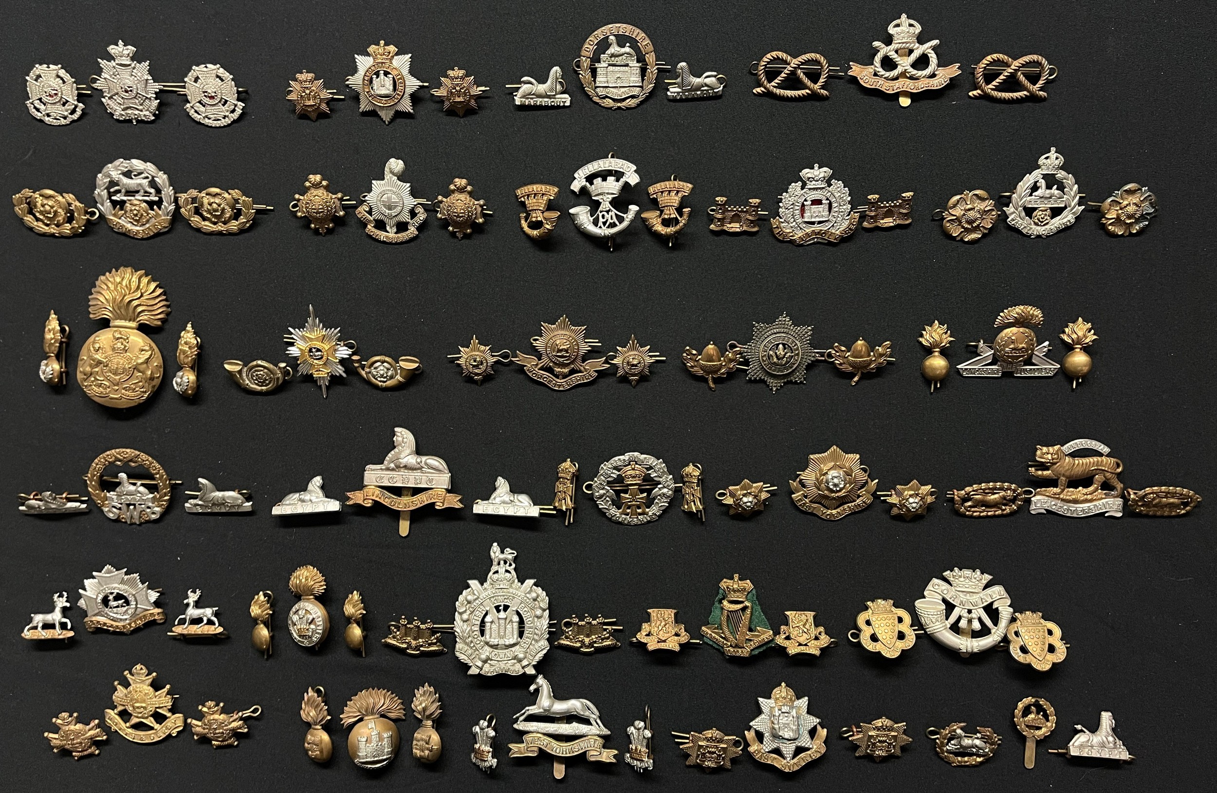 WW2 British Cap Badges together with matching Collar Dogs to include: Border Regt: Devonshire Regt: Dorsets: South Staffs: Hampshires: Royal Sussex Regt: Somerset Light Infantry: Suffolks: East Lancs: Royal Scots Fusiliers: Worcestershire Regt: Lincolns: Green Howards: East Yorks: Leicestershire Regt: Bedfordshire Regt: RWF: KOSB: Royal Irish Regt: Duke of Cornwalls Light Infantry: Notts & Derbys brooch pinned: Inniskilling Fusiliers: West Yorks: East Surrey Regt: Gloucestershire Regt back badge.