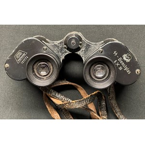 WW2 Third Reich Rare Waffen SS issue 6x30 Dienstglas Binoculars maker RUKA Rathenow, serial number 101774. Complete with original leather neck strap, black bakelite case and bakelite lens covers.