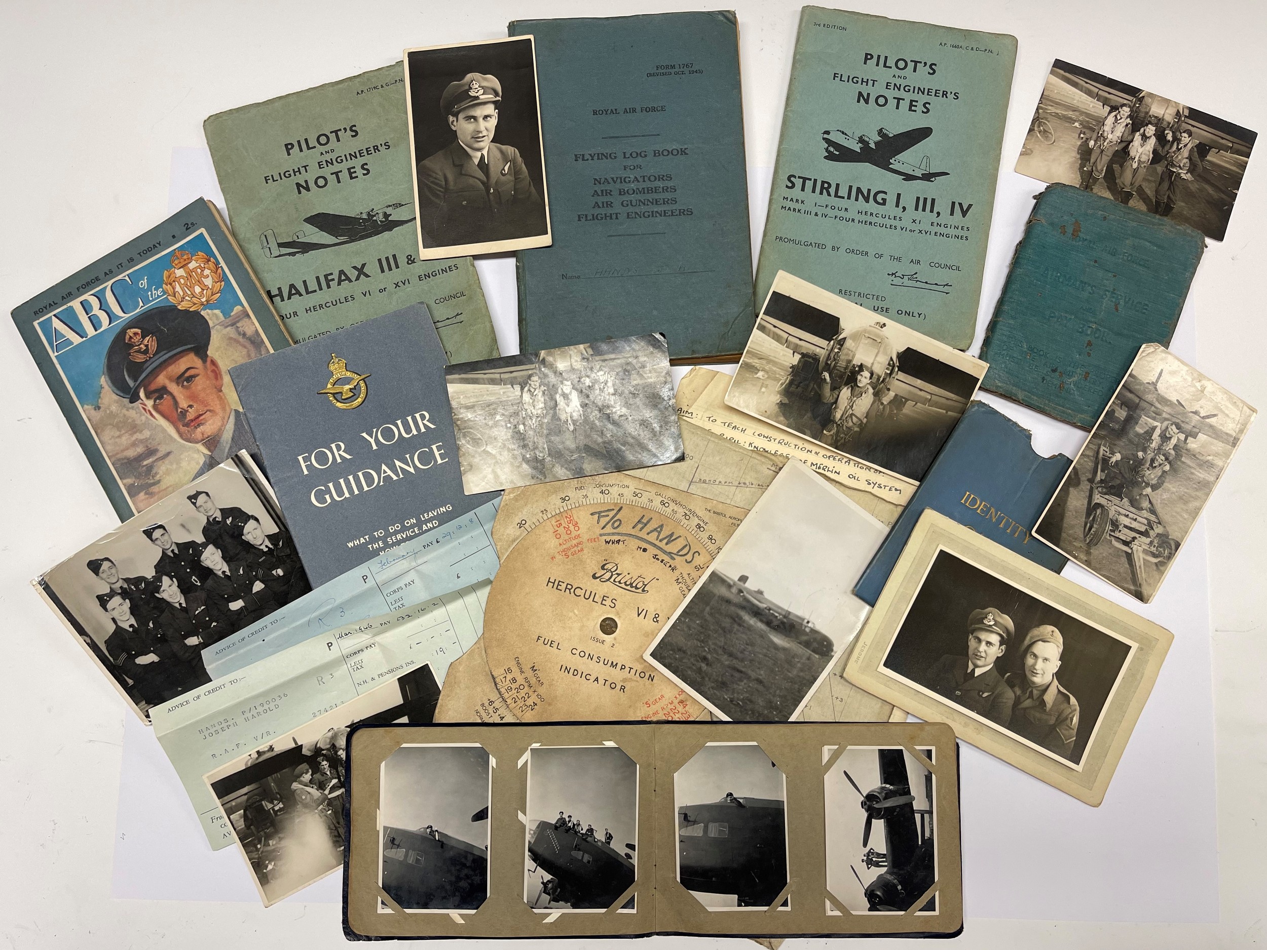 WW2 British RAF Halifax Flight Engineers flying log book group to 1488684 Joseph Harold Hands, later Sgt, later Flying Officer: comprising of: Airmans Pay Book dated 1941: Log Book begins 9/7/44 at 1666 Conversion Unit, moves to 426 Sqd on 8/9/44 completing 31 Ops by 2/2/45 when he was "Screened". Further non operation flying until demobbed in 1946 having completed 222 daylight hours and 202 Night Hours. Also included in this group are: Private Photo album with over 20 unpublished photos of him and the crew in flying kit along with their aircraft etc: original "Pilots Notes" books for Halifax III & VII and Stirling I, III, IV: Hercules VI & XVI Fuel Compsumption Indicator Calculator: "ABC of the RAF" and "For Your Guidance booklets": Pay slips, notes, RAPC shoulder title, etc. New to the market. Please see lot 5218 in this sale for his flying helmet & Oxygen mask.