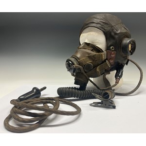 WW2 British RAF C Type Fling Helmet complete with headsets and wiring loom with jack plug together with matching G Type Oxygen Mask. Ex Flying Officer Hands. Together with his RAF cap badge (missing one lug) and various RAF payslips named top him. NOTE: Lot no 5210 in this sale features his log books and photos. New to the market.
