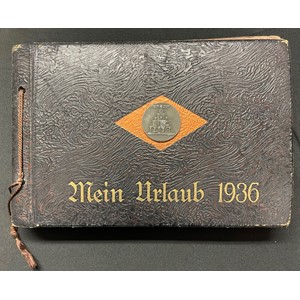 WW2 Third Reich "Mein Urlaub 1936" ("My Holiday 1936") Private unpublished photograph album. Size 29cm x 19cm. Reichspartei Tag 1936 rally badge affixed to the cover. The album is very well presented with captions, photographs, newspaper cuttings, postcards, etc. Unpublished photos of Hitler, Rudolf Hess etc taken outside the Hotel Deutscher Hof. Over 200 photos, all showing very good content, NSDAP, SA, SS inc LSSAH, Blood Flag, Fuhrer Standard, Feldherrnhalle, Ehrentempel. Each location is captioned, Nuremberg, Munich, Party Rally Stadium, Wehrmacht, SS, SA, Zeppelin, Other cities include Erfurt, Wartburg, Frankfurt am Main, Heidlberg. Includes pre printed personal invite from Hitler to the Bulgarian PM (not filled in), Dec 1943 Hitler Xmas and New Year Thank you card, Waffen SS Newspaper and magazine articles, Army enlistment papers, etc, etc.