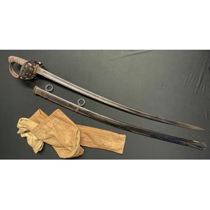 British Victorian X Lancers Cavalry Officers Sword with fullered curved blade 890mm in length with etched decoration to both sides with battle honours, VR and Queens Crown, Proof marked along with makers mark for Henry Wilkinson, Pall Mall, London. Spine of blade numbered 14811. Felt washer still in place. Wire bound grip. Overall length 105cm. Complete with plated scabbard with twin suspension rings. In addition it has a chamois leather cover and a cloth cover. Cover is named to "Major England". NOTE: Major England's medals also feature in this sale as lot 3000.