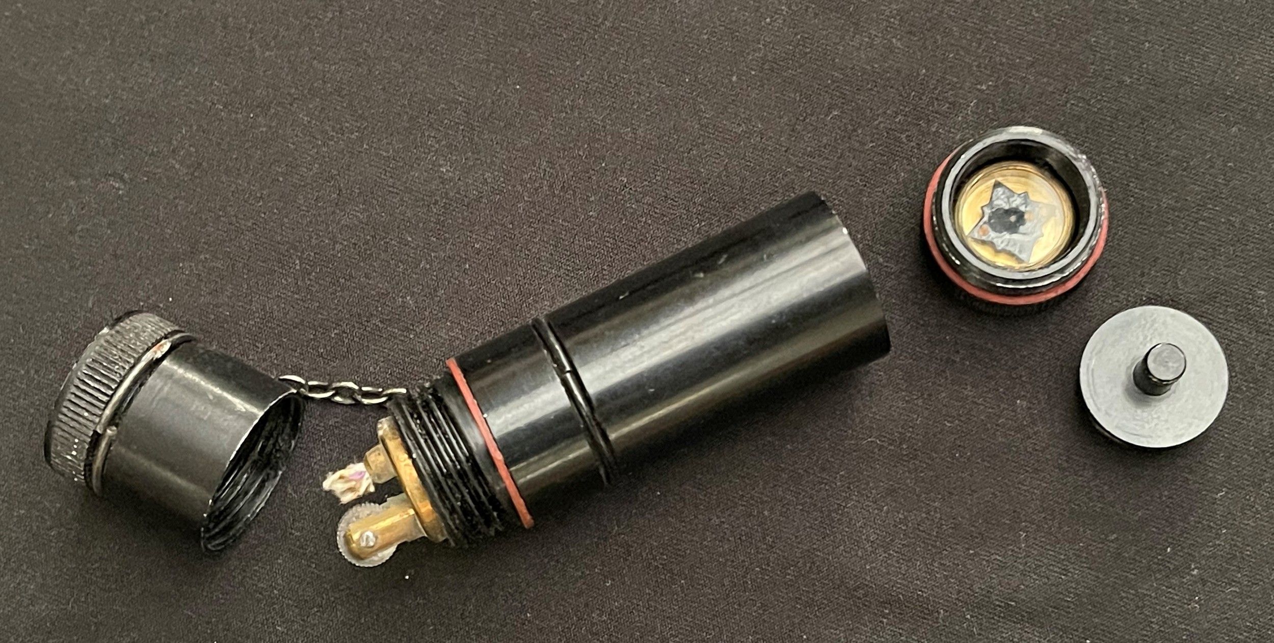 WW2 British RAF/SOE Cigarette Lighter with hidden escape compass. 78mm in length. Unissued condition.