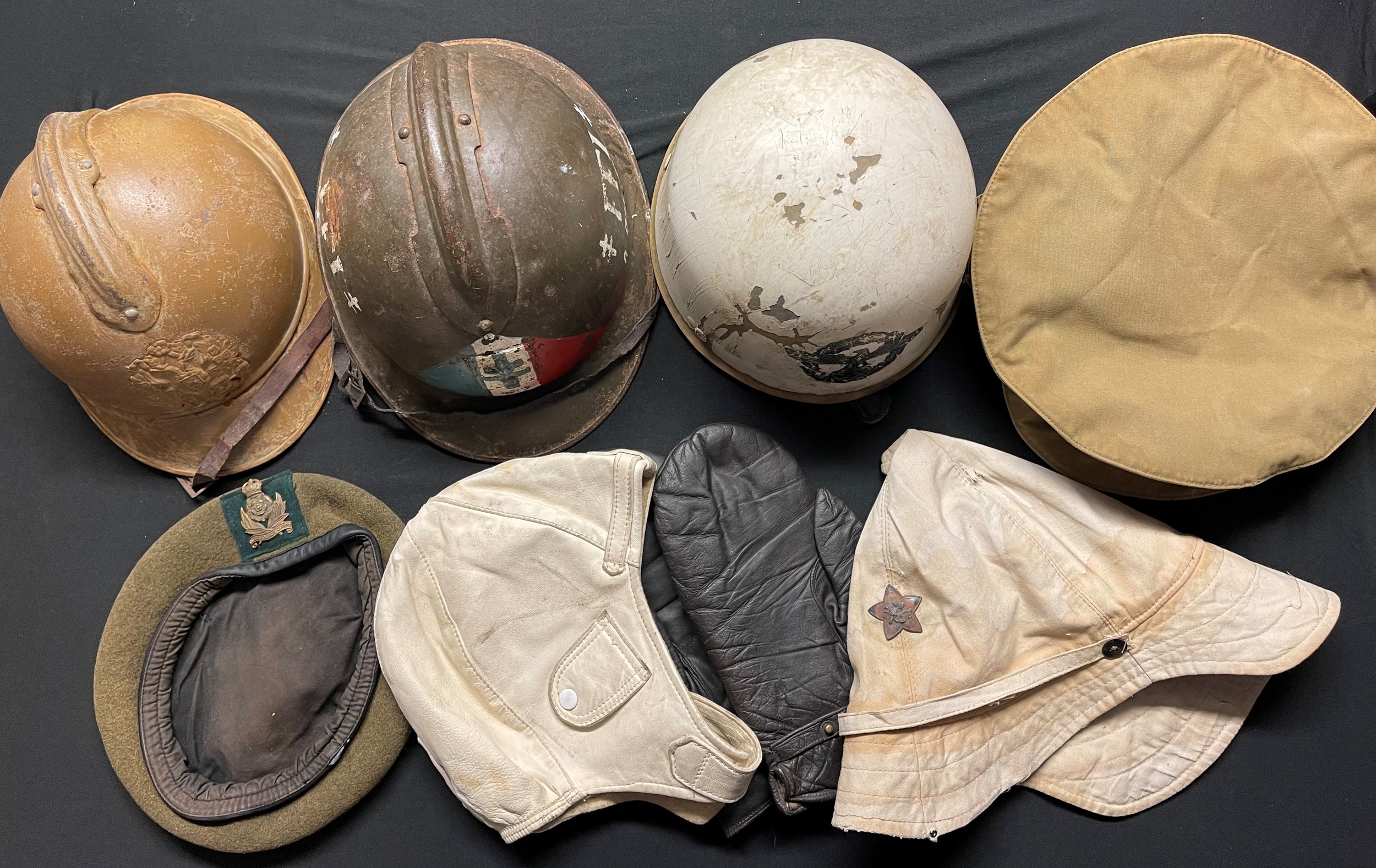 Reproduction Headgear collection to include: WW1 Russian helmet, WW2 French FFI Helmet, Danzig Police Crash Helmet, original 1930's leather motoring helmet, WW1 British Gor Blimey cap, Russian cap, etc.