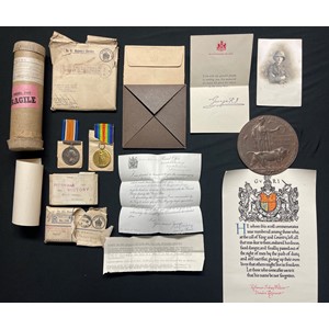 WW1 British London Regiment Death Plaque Group to 3955 Pte Sidney Wilkins, 11th Battl London Regt (Finsbury Rifles) comprising of: Death Plaque in original card cover with postage cover, Scroll in original carboard postage tube with Kings letter, War Medal and Victory Medal in original packets with ribbons and envelope along with a portrait photograph of Rifleman Wilkins. KIA 11th April 1917. New to the market.
