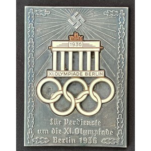 WW2 Third Reich 1936 XI Olympiade Berlin non portable award. Inscribed "Fur Verdienste um die XI Olympiade Berlin 1936". Two part construction with Enamel Brandenburg Gate and Olympic Rings. Size approx. 95mm x 70mm.