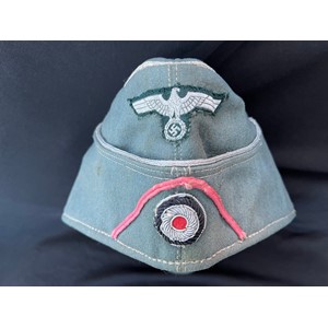 WW2 Third Reich Heer Officers M38 Feldmutze in fine doe skin wool. Early war dark green backed Bevo machine woven flatwire eagle. Bullion embroidered national cockade. Silver wire pipred. Panzer Pink Soutach. Size 57. Cotton lined with partial grey leather sweatband marked "Qualitats Marke". Zink air vents. Field repair to rear of cap.