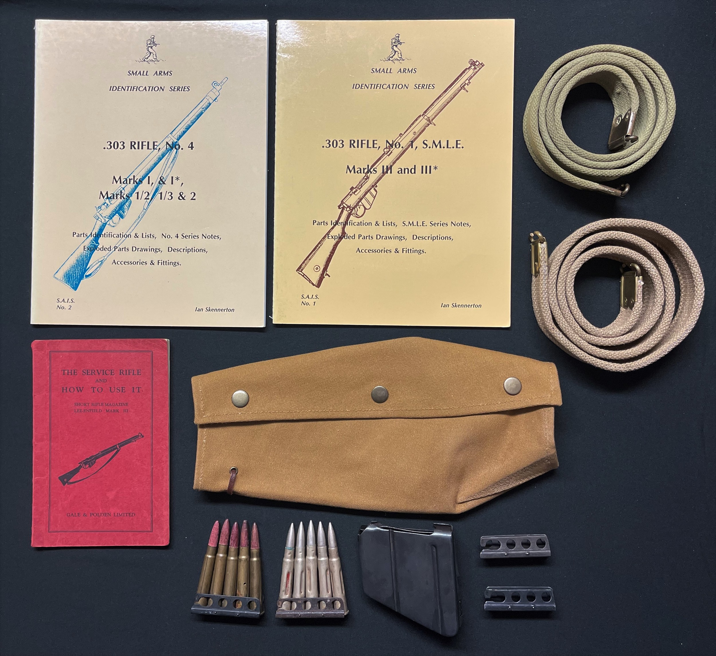 WW1 British SMLE webbing rifle sling maker marked and dated "Warrings 1917": SMLE spare magazine, with inspection markings: two clips of inert .303 training rounds: Training Manual dated 1940: reproduction sling and action cover: Small Arms Identification Series books on the SMLE and No4 Rifles by Ian Skenneton: pair of charging clips: Nose cap screw. NOTE: UK Bidders only on these items please.