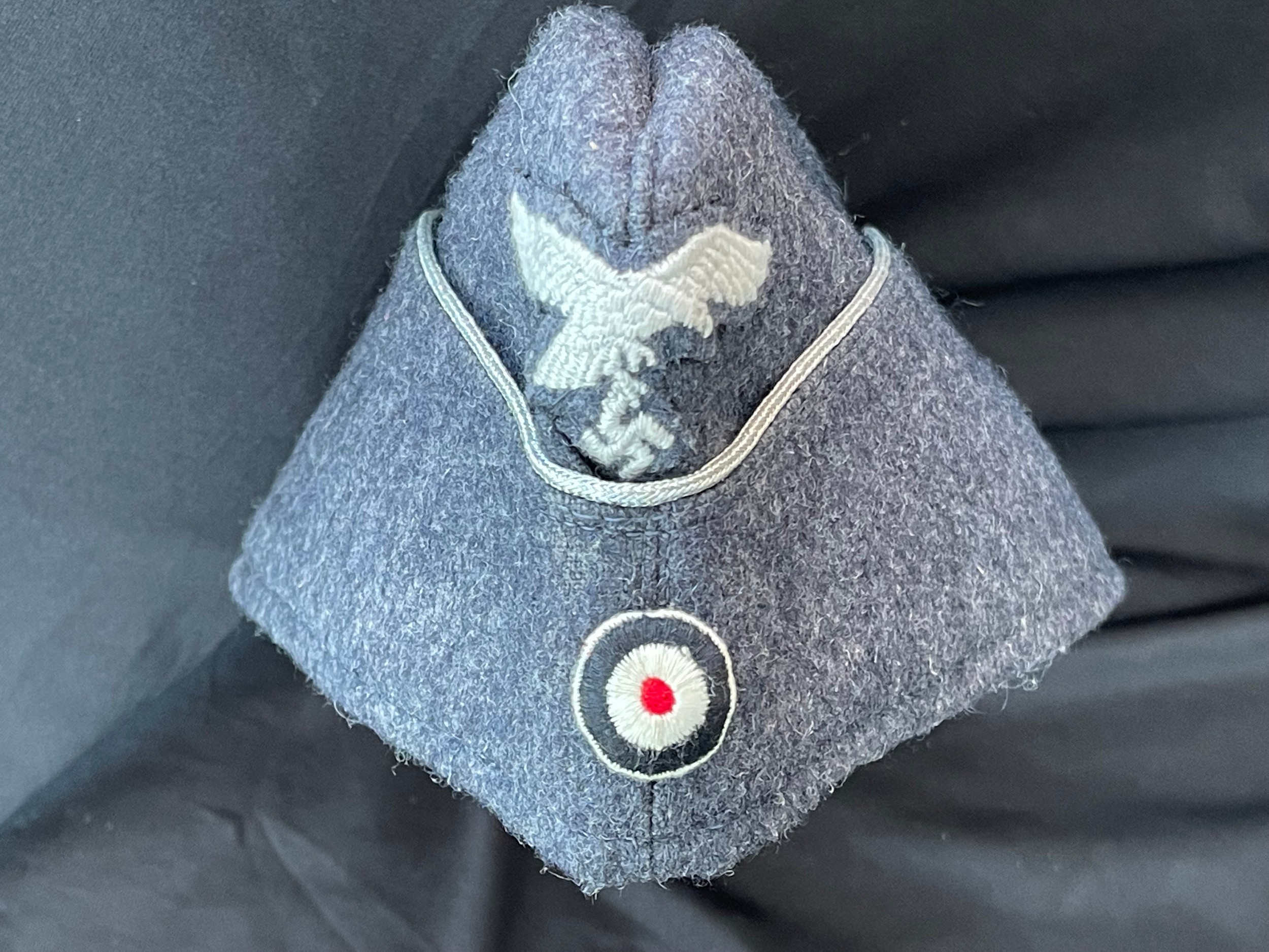 WW2 Third Reich Luftwaffe Officers Fliegermutze in good quality wool with enlisted mans quality insignia and silver bullion wire applied to the turn up. Grey rayon lined with a light grey faux leather sweatband. Size 57 1/2. No makers mark.