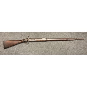 A Volunteer two band Enfield "bar on barrel"  Percussion Cap short rifle, the lock stamped "Conway Manchester". 83cm long barrel. Overall length 124cm. Working action. Missing Nipple. The stock with "tiger stripe" pattern. No ramrod. NOTE: Section 58 (2) No licence required in the UK.