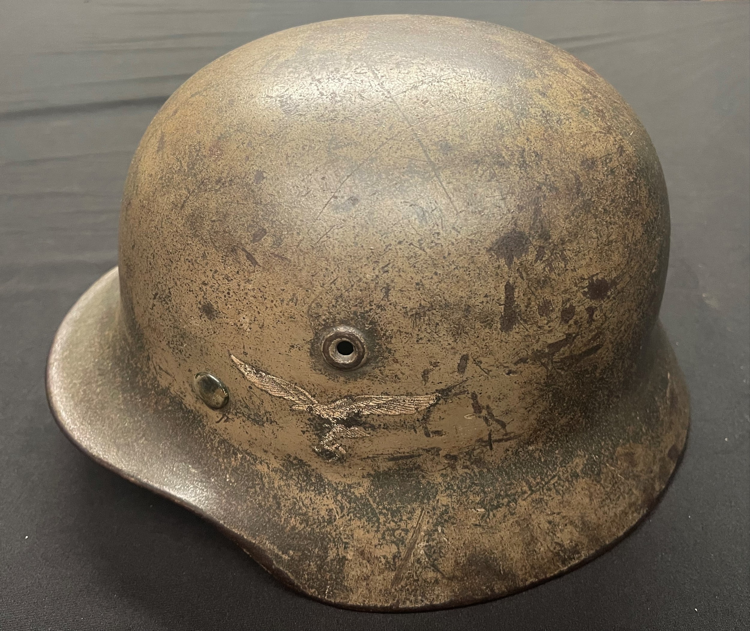 WW2 Third Reich Luftwaffe M40 Italian Front Tan Camo Steel Helmet. Single decal. Maker and size marked "Q62". Lot number 161. Complete with original liner size marked 54 along with original owners initials "A.Sch". Chinstrap is maker marked "Sattler Lago Wien 1941".