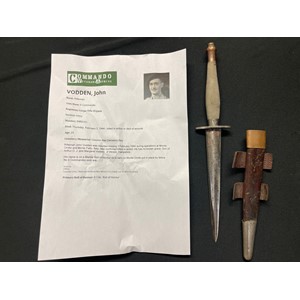 WW2 British all nickel second pattern Fairbairn Sykes Fighting Knife. The guard marked. /|\56 and the initials "J.V." to the grip. Housed in its leather scabbard with nickel chape. Faint soldiers number to the rear. Attributed to John Vodden, Rifle Brigade and 9th Commando
