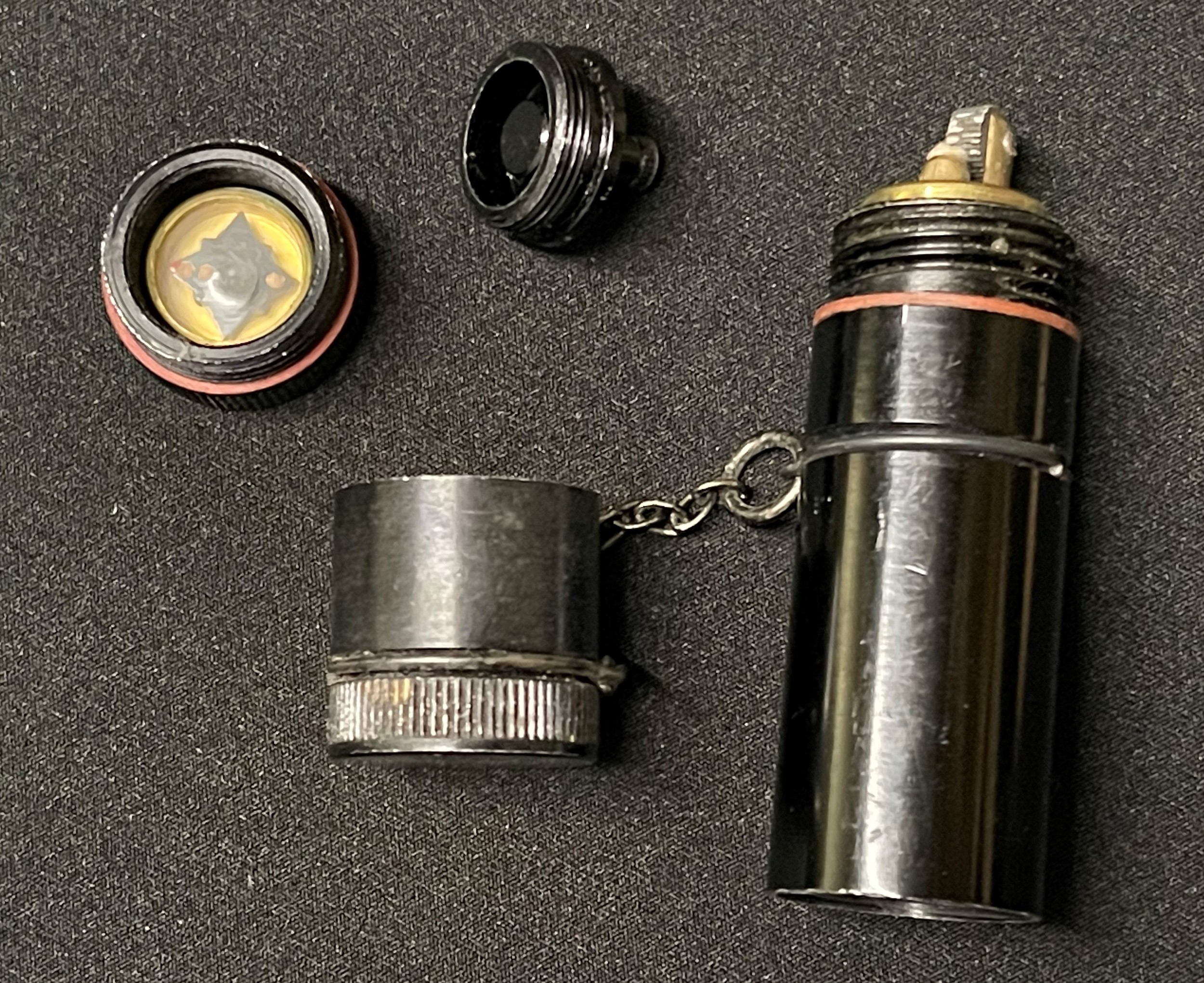 WW2 British RAF/SOE Cigarette Lighter with hidden escape compass. 78mm in length. Unissued condition.